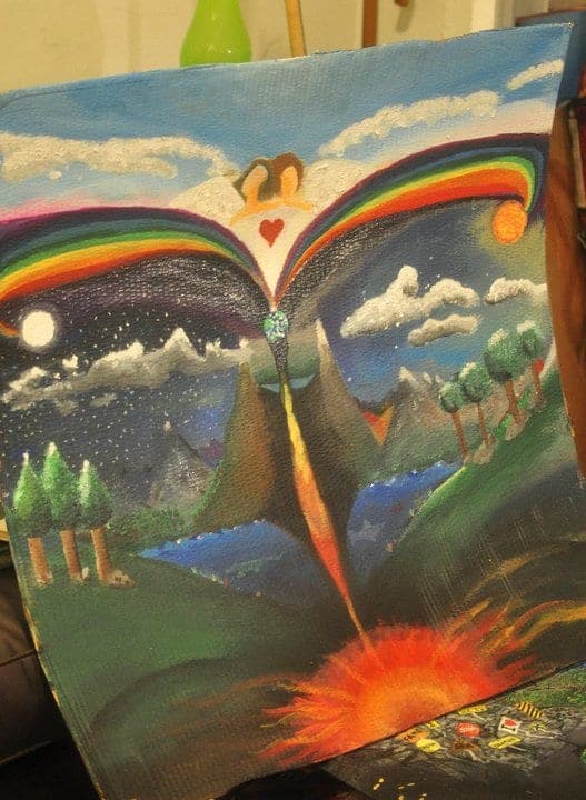 Rainbow figure painting with flowing color.