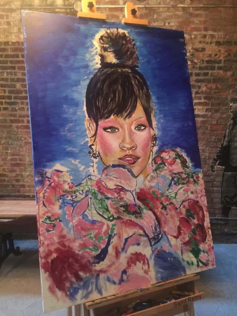 Rihanna portrait on easel in the studio, full view of the finished painting.