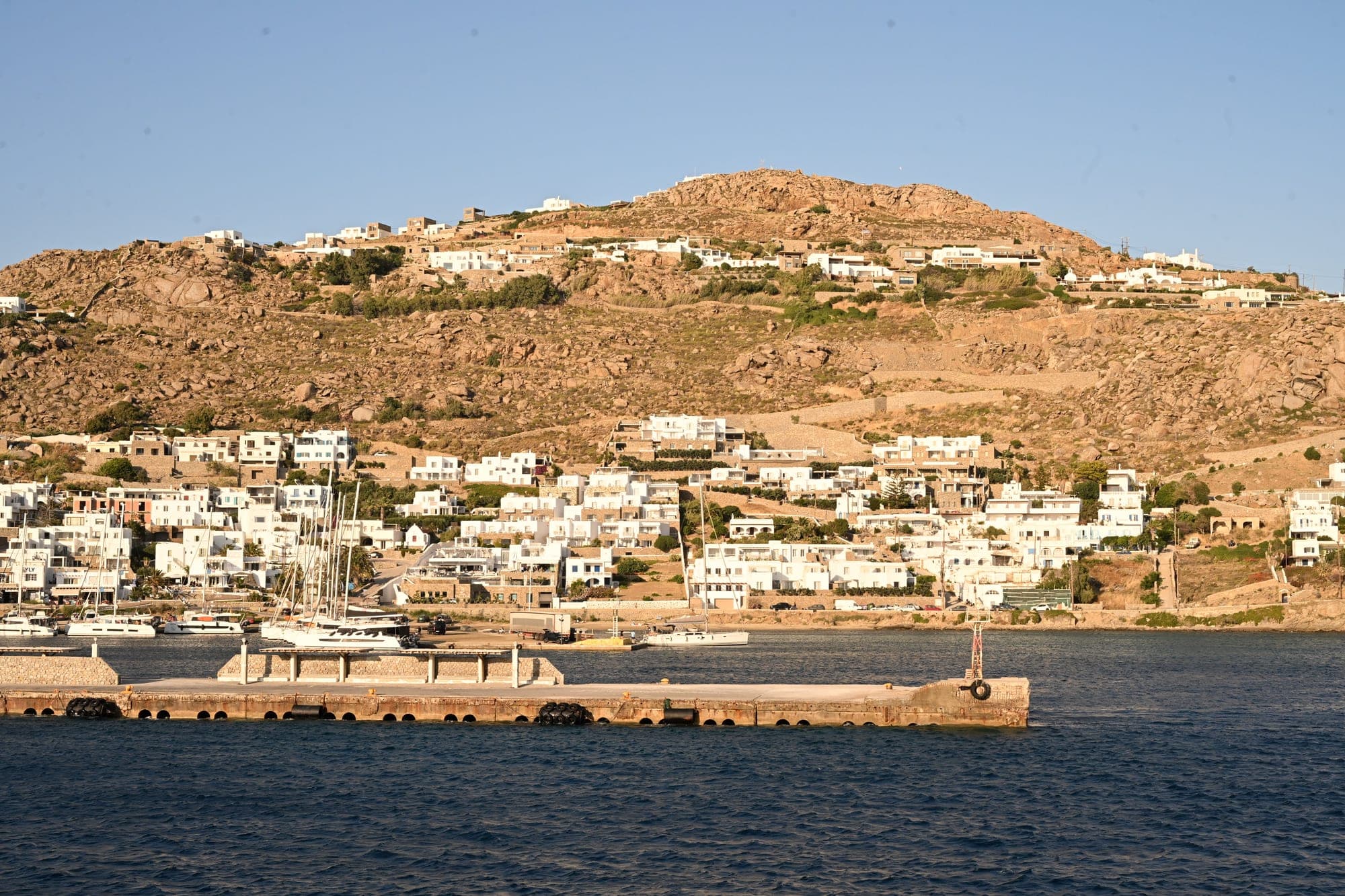 Greece, whitewashed architecture and sea.