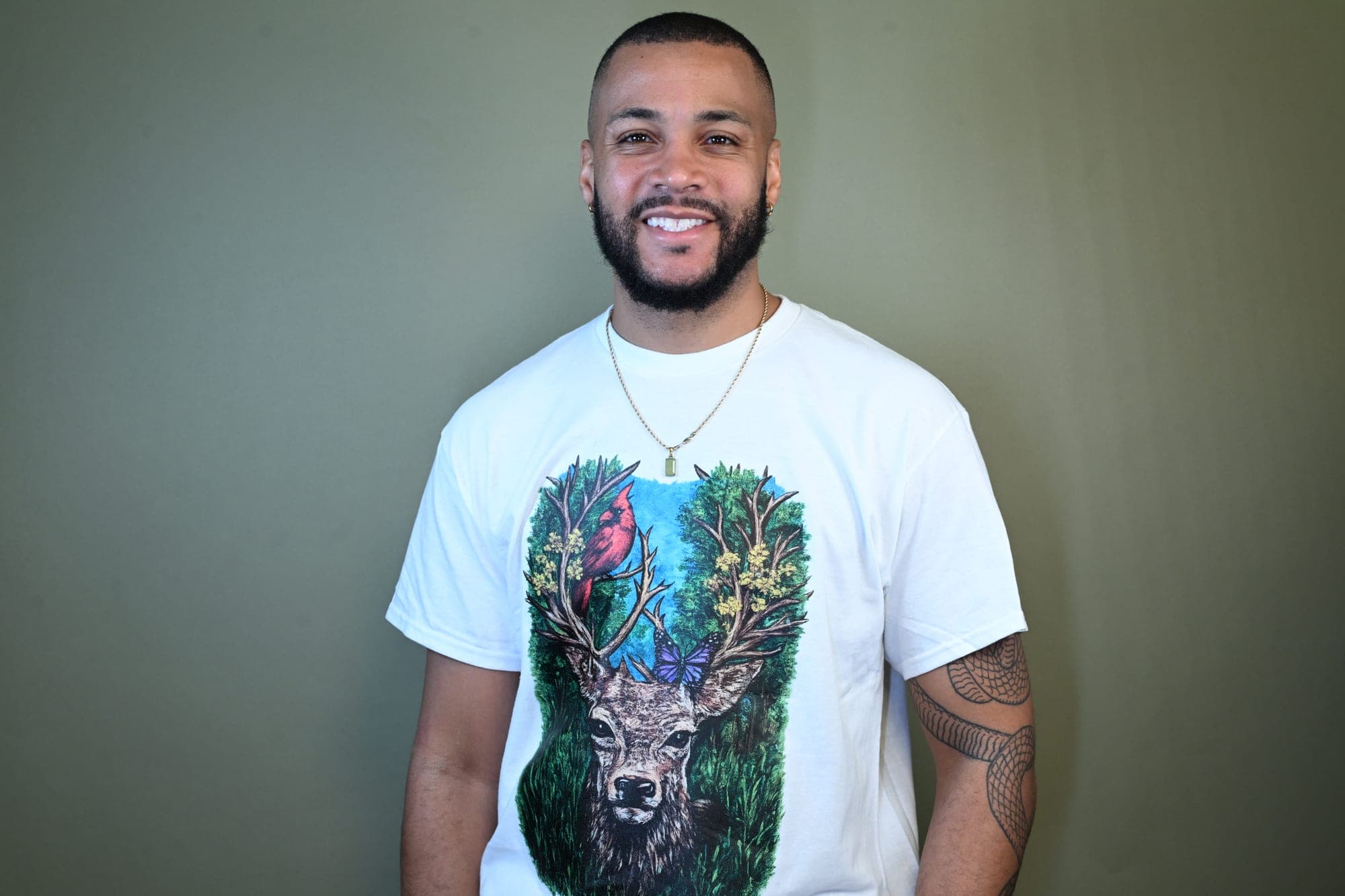 Studio portrait, deer painting shirt.
