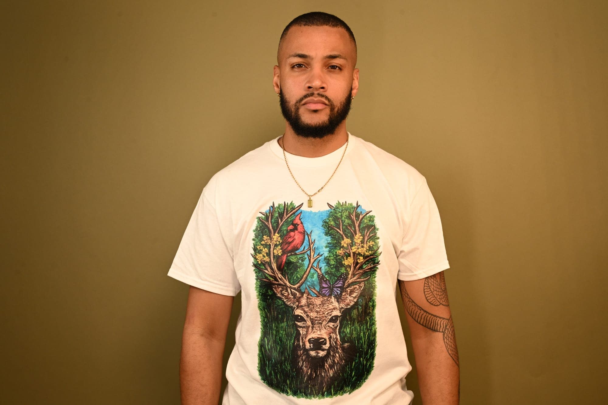 Portrait wearing Kamo King deer artwork tee.